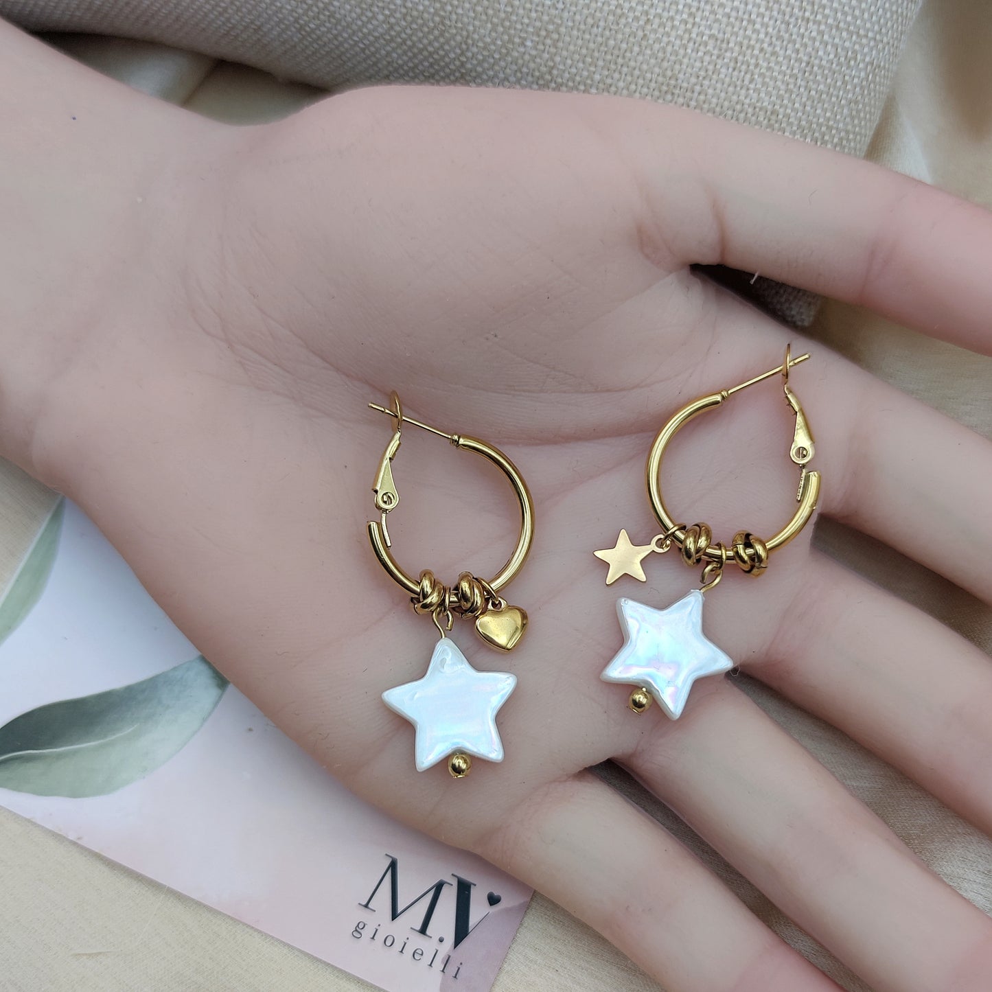 Orecchini stella madreperla