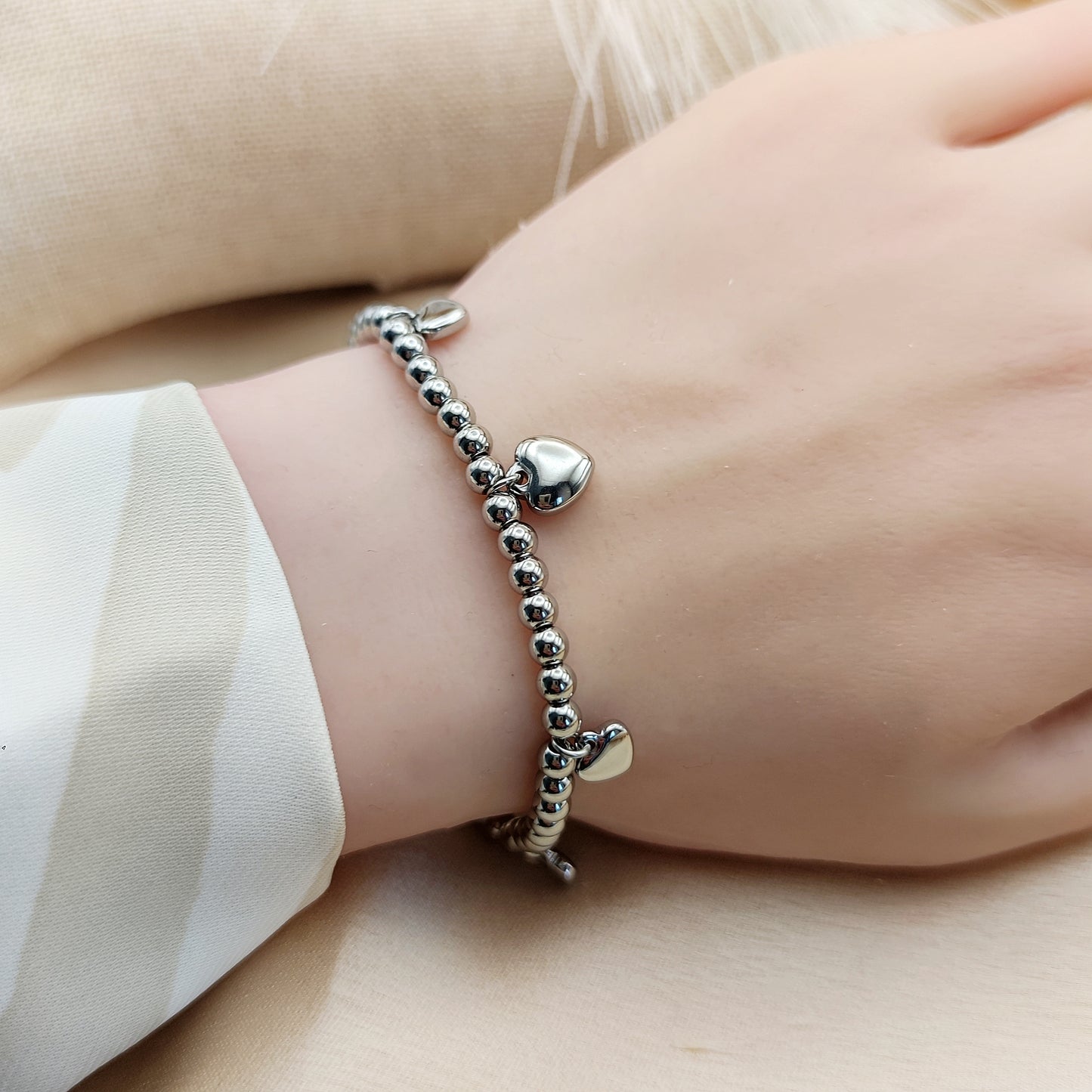 Bracciale sfere cuori charms