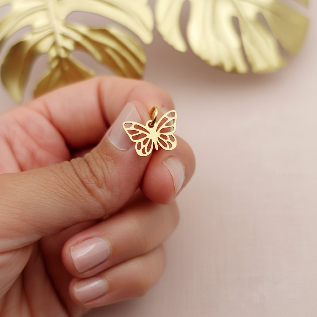 Charm farfalla traforata gold