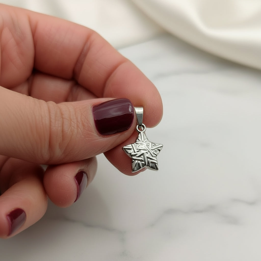 Ciondolo stella zig acciaio