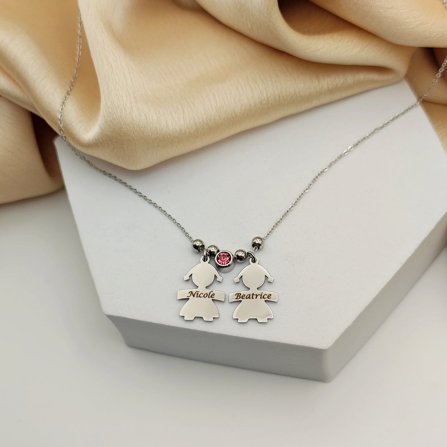 Collana due bebè punto luce