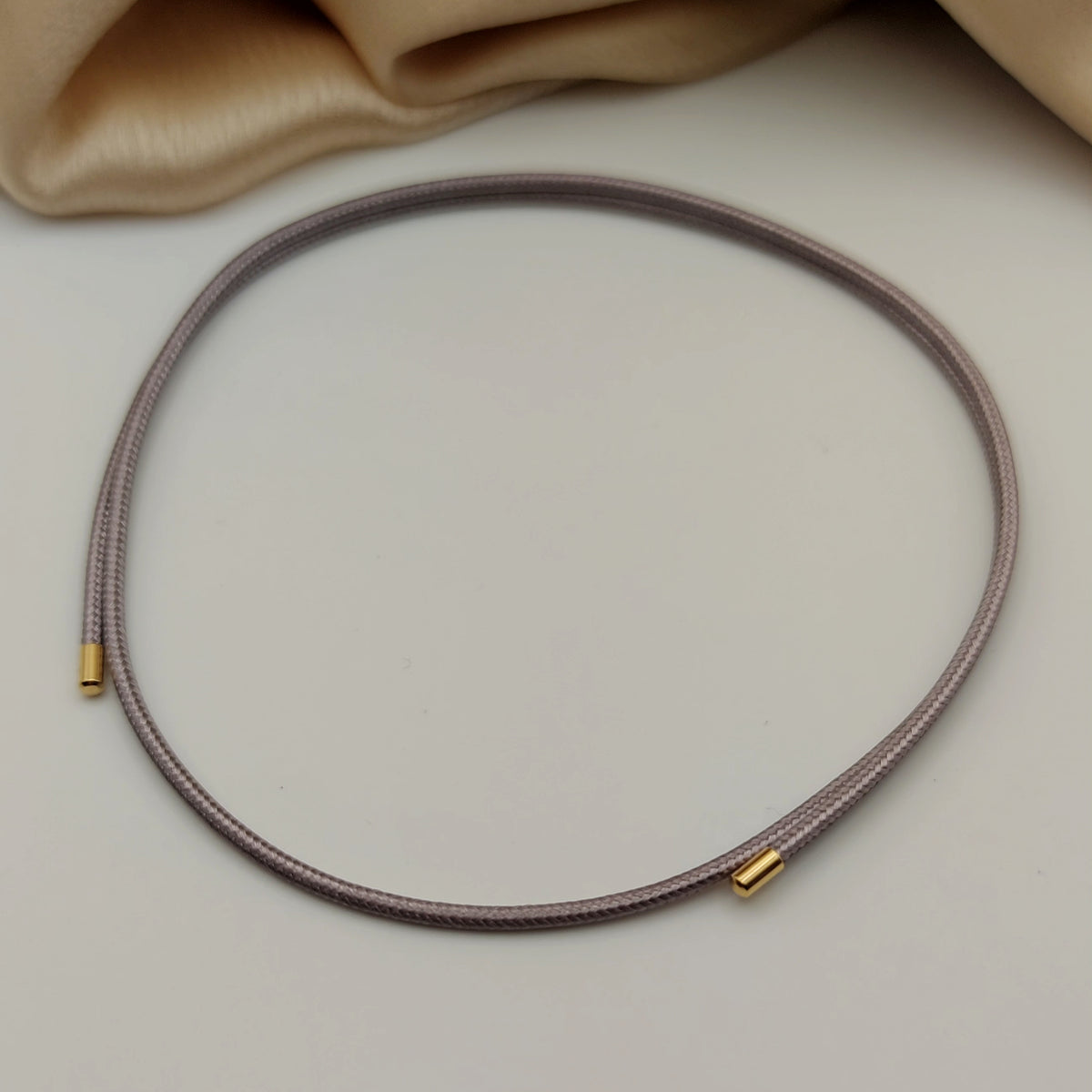 Choker calamita grigio/lilla chiaro